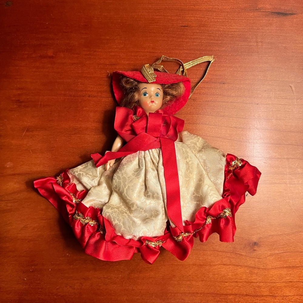 Charming Vintage Plastic Doll in Red and Cream Dress